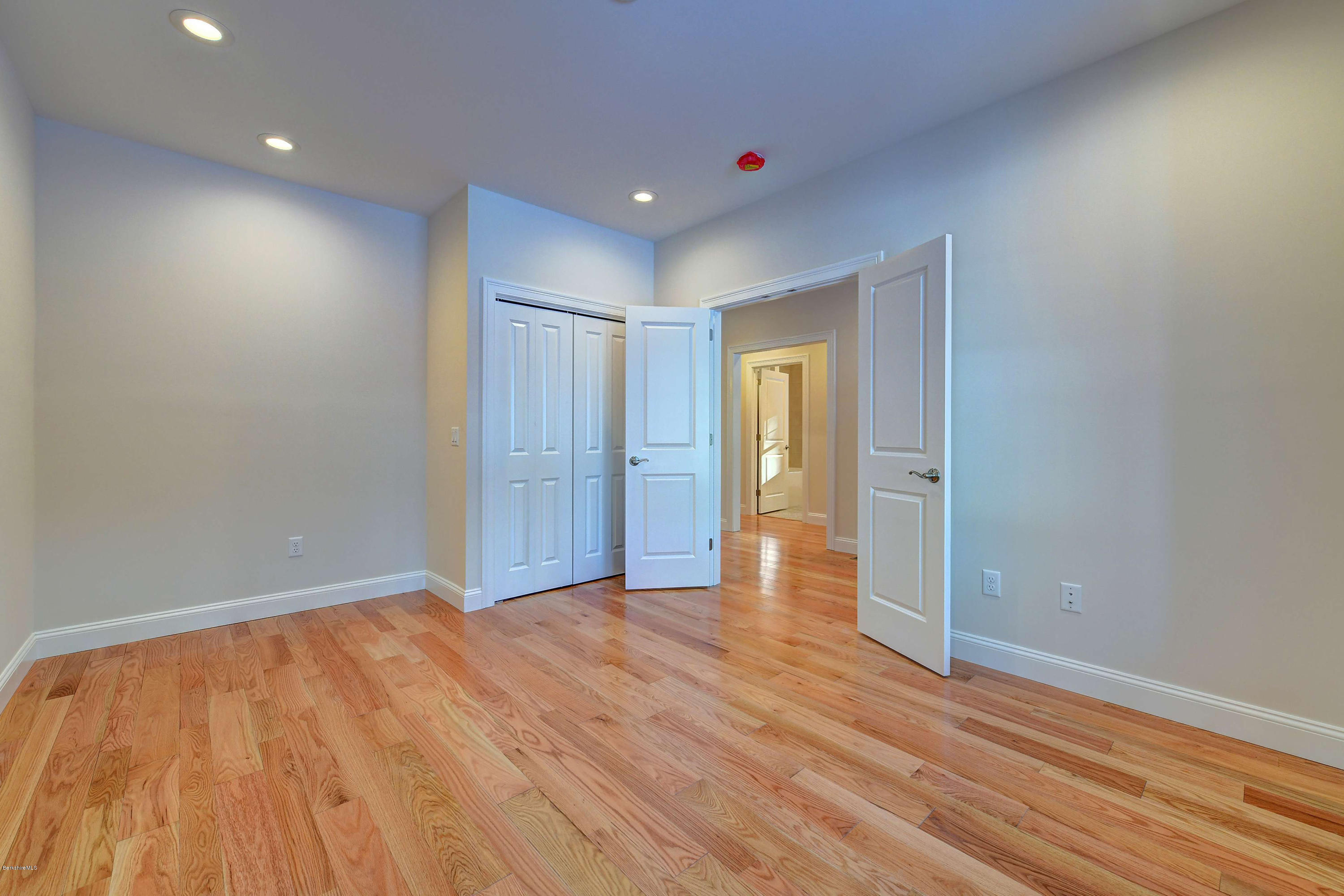 1 B West Dale Road Stockbridge, MA 01262 - Photo 19 of 26 a view of an empty room with wooden floor and closet
