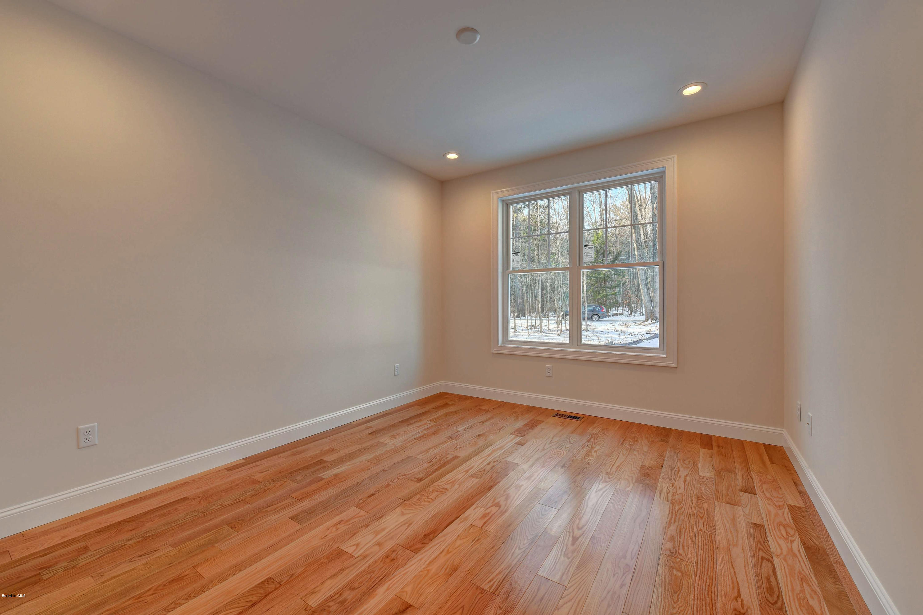 1 B West Dale Road Stockbridge, MA 01262 - Photo 20 of 26 a view of an empty room with wooden floor and a window