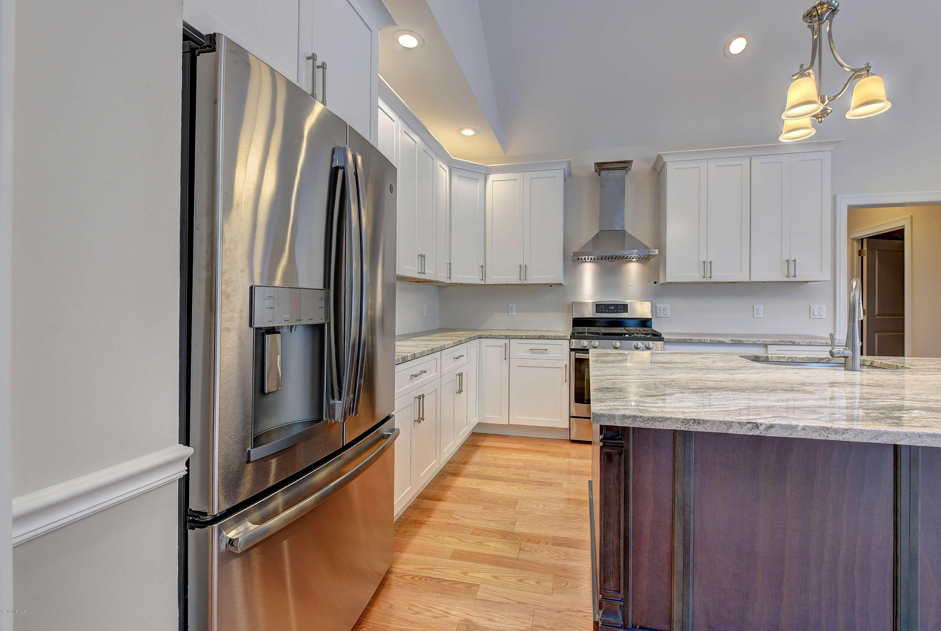 1 B West Dale Road Stockbridge, MA 01262 - Photo 10 of 26 a kitchen with stainless steel appliances granite countertop a refrigerator a stove and a sink