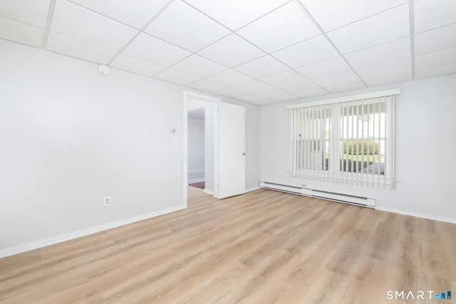 a view of an empty room with a window