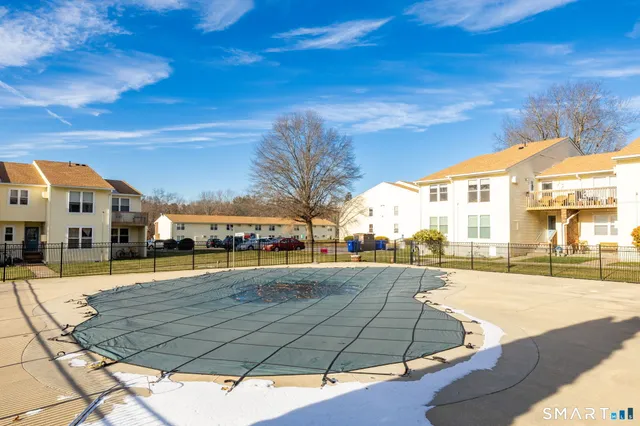 a view of a building with a yard