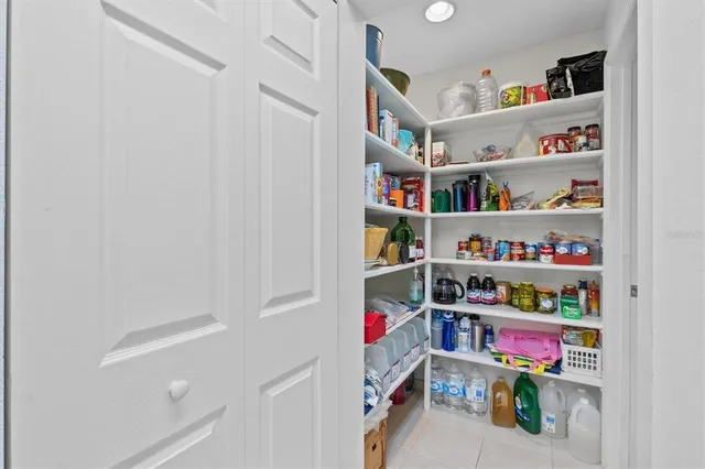 a view of a house with backyard porch and sitting area