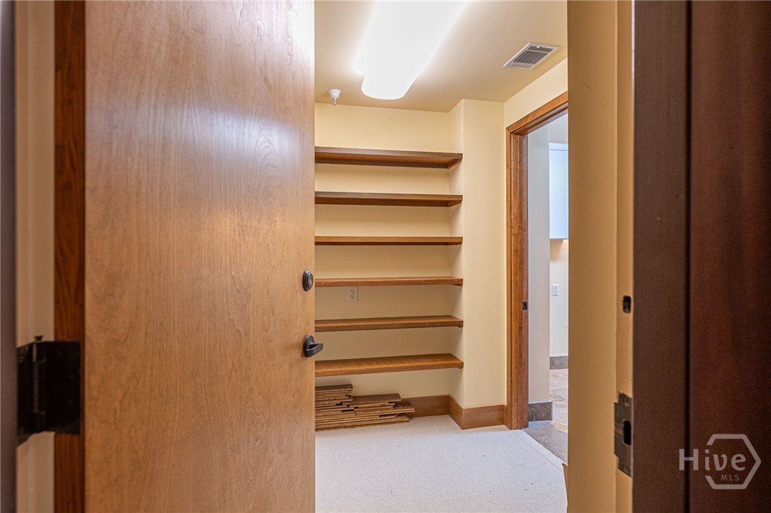 300 Bull Street, Unit 601 Savannah, GA 31401 - Photo 53 of 57 Laundry room equipped with sink and large storage room