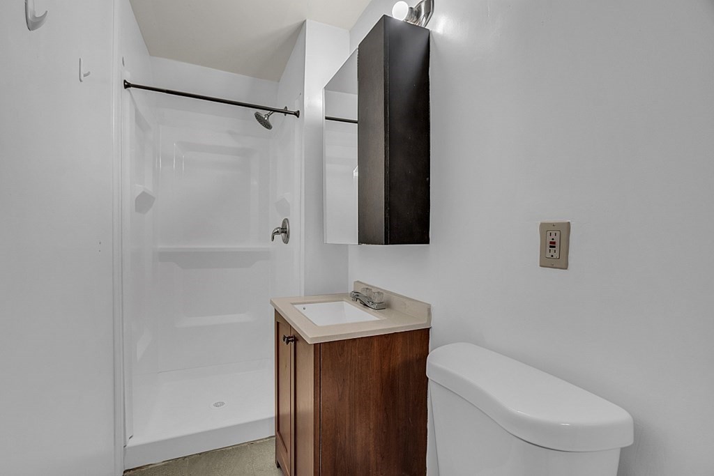 51 A Cedar Street Worcester, MA 01609 - Photo 22 of 27 a bathroom with a toilet a sink and shower