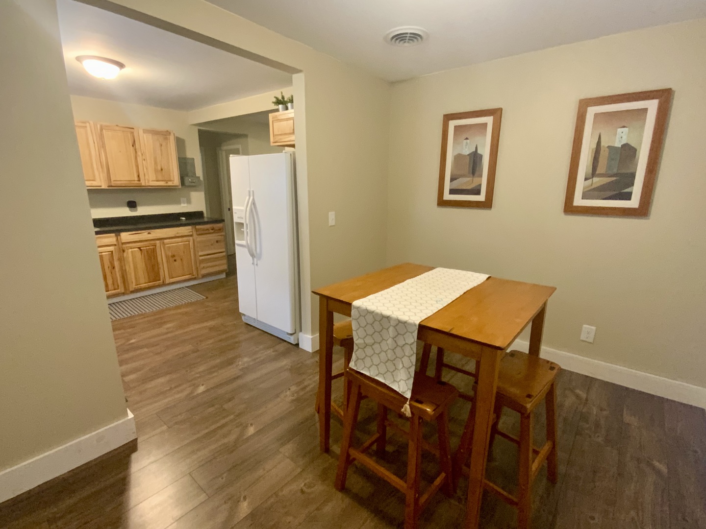 1187 Catherine Street Ottawa, IL 61350 - Photo 11 of 19 a kitchen with stainless steel appliances a refrigerator and wooden floor