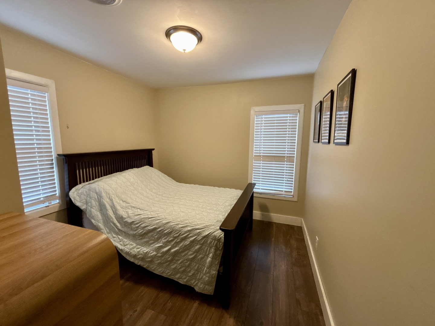 1187 Catherine Street Ottawa, IL 61350 - Photo 16 of 19 a bedroom with a bed and wooden floor