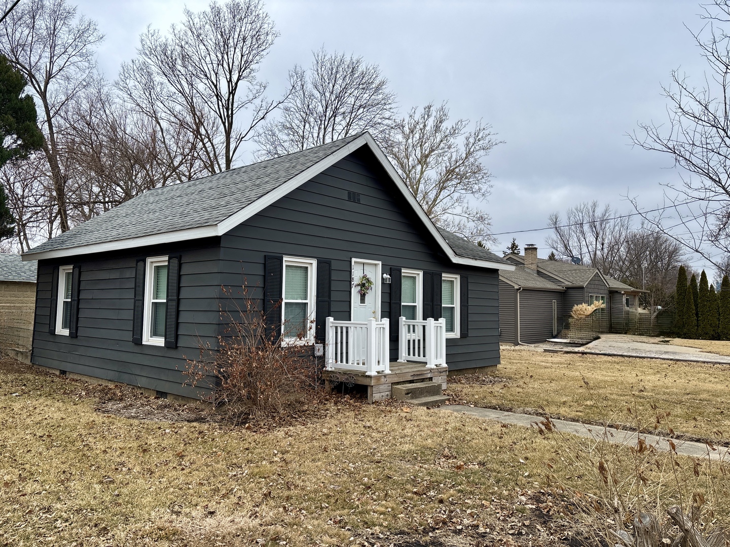 1187 Catherine Street Ottawa, IL 61350 - Photo 5 of 19 a front view of a house with a yard covered in snow