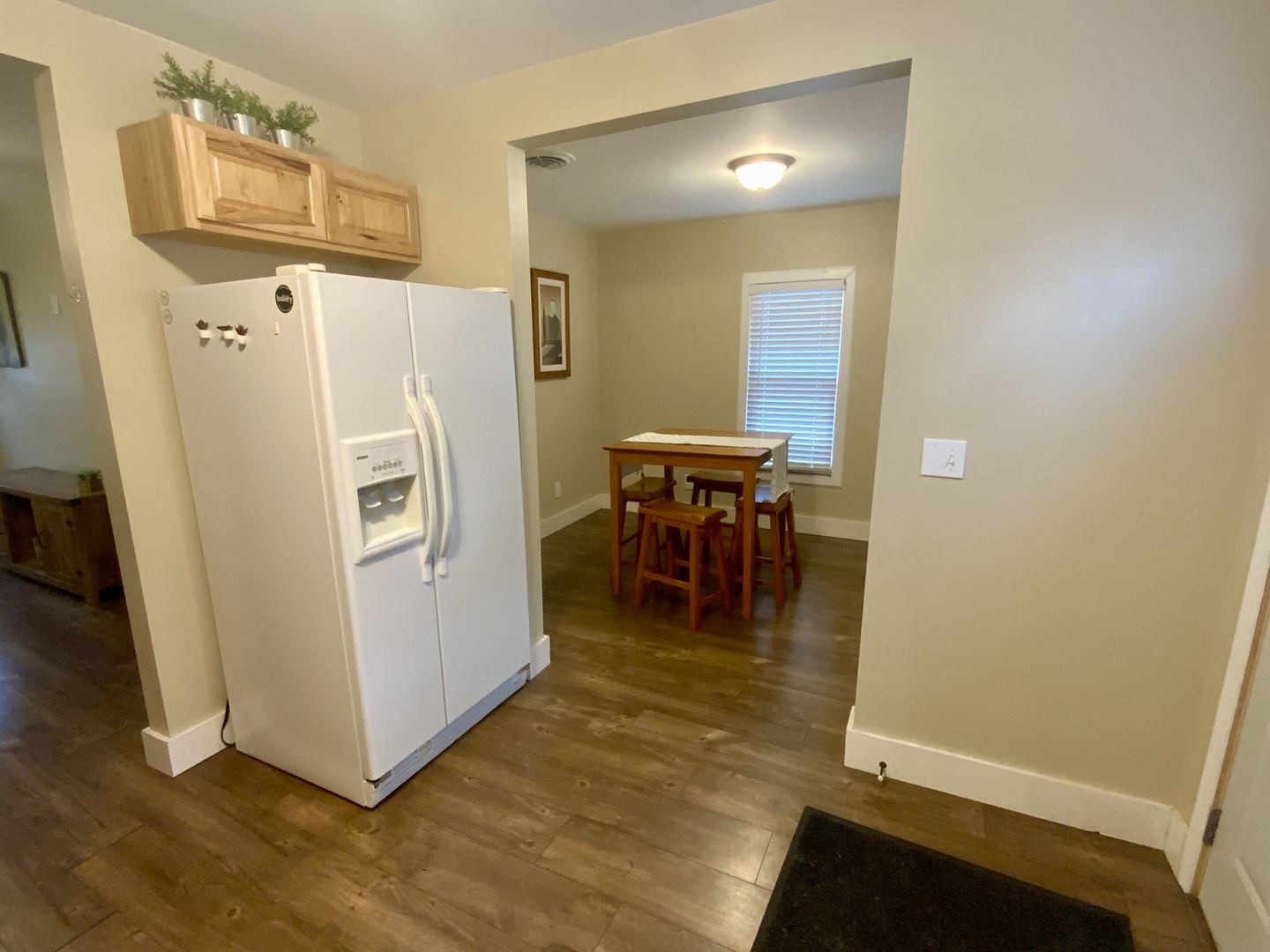 1187 Catherine Street Ottawa, IL 61350 - Photo 10 of 19 a view of a kitchen with dining area and refrigerator