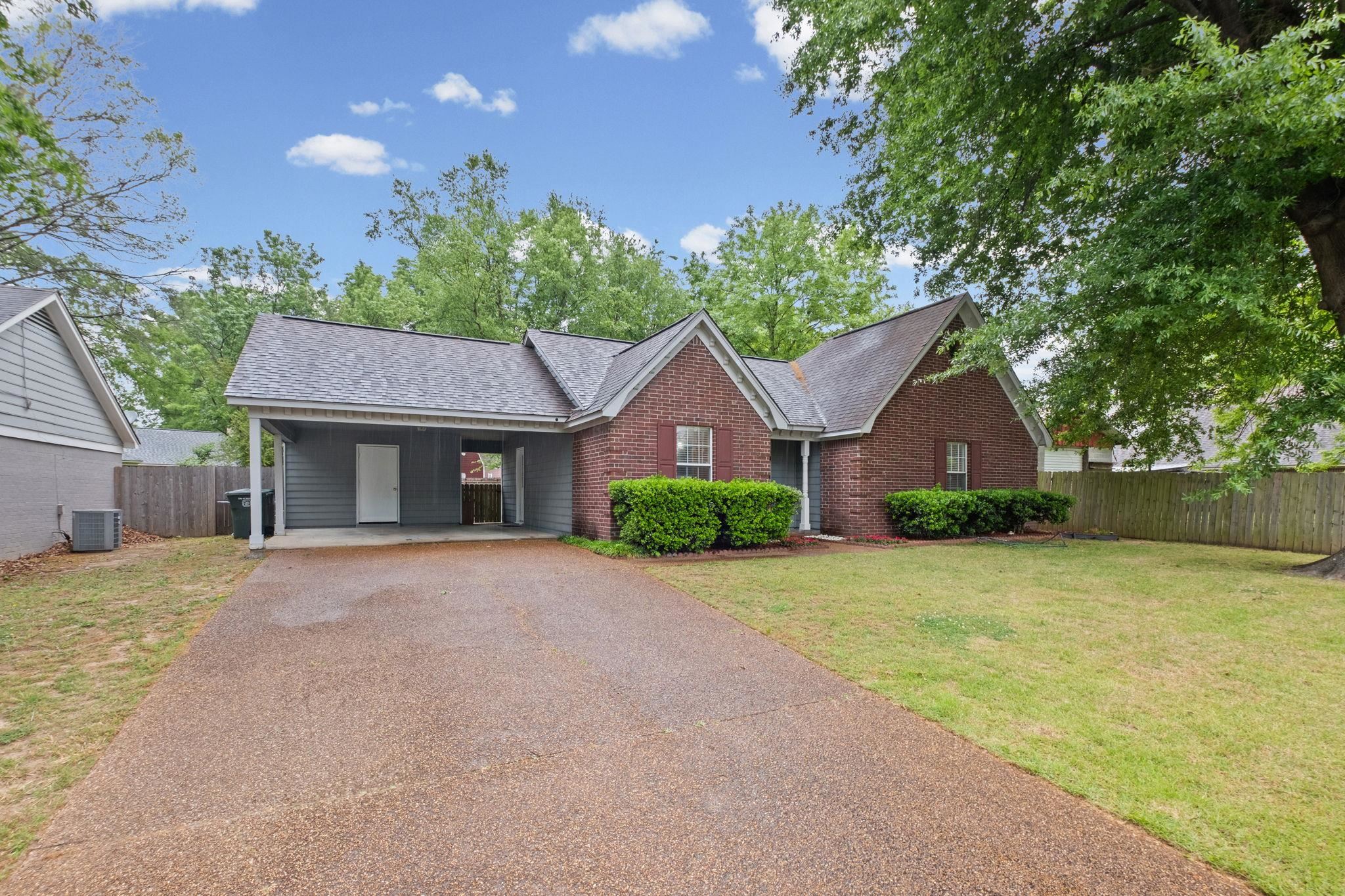 7788 Reese Road Memphis, TN 38133 - Photo 2 of 23 Brick and siding exterior with a dark shingle roof