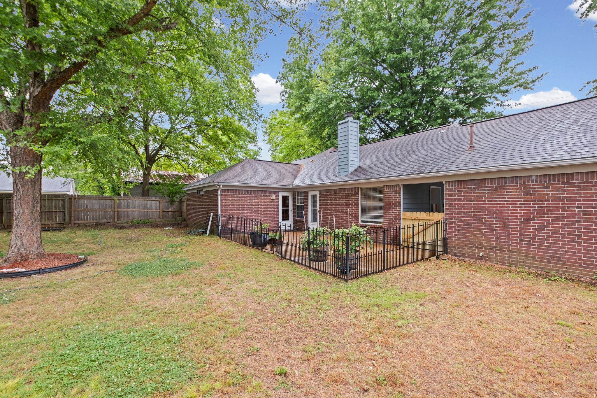 7788 Reese Road Memphis, TN 38133 - Photo 21 of 23 Beautiful escape in the back yard featuring a patio area, and a large shade tree