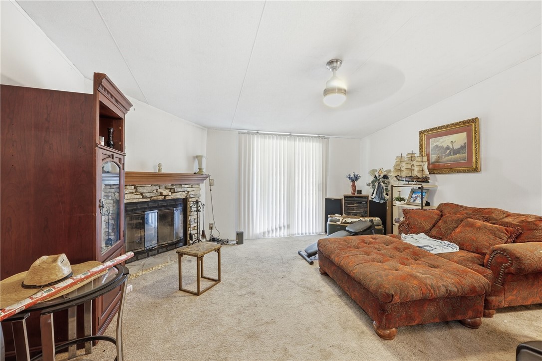5730 Mockingbird Lane Mathis, TX 78368 - Photo 15 of 40 a living room with furniture and a fireplace