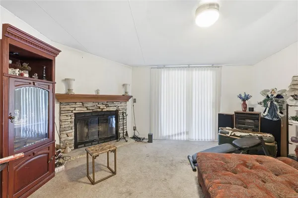 a bedroom with furniture and a fireplace