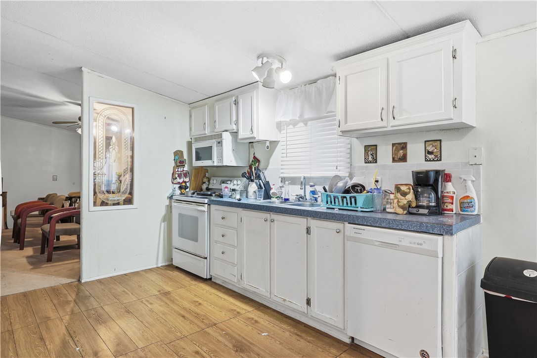 5730 Mockingbird Lane Mathis, TX 78368 - Photo 19 of 40 a kitchen with white cabinets and sink