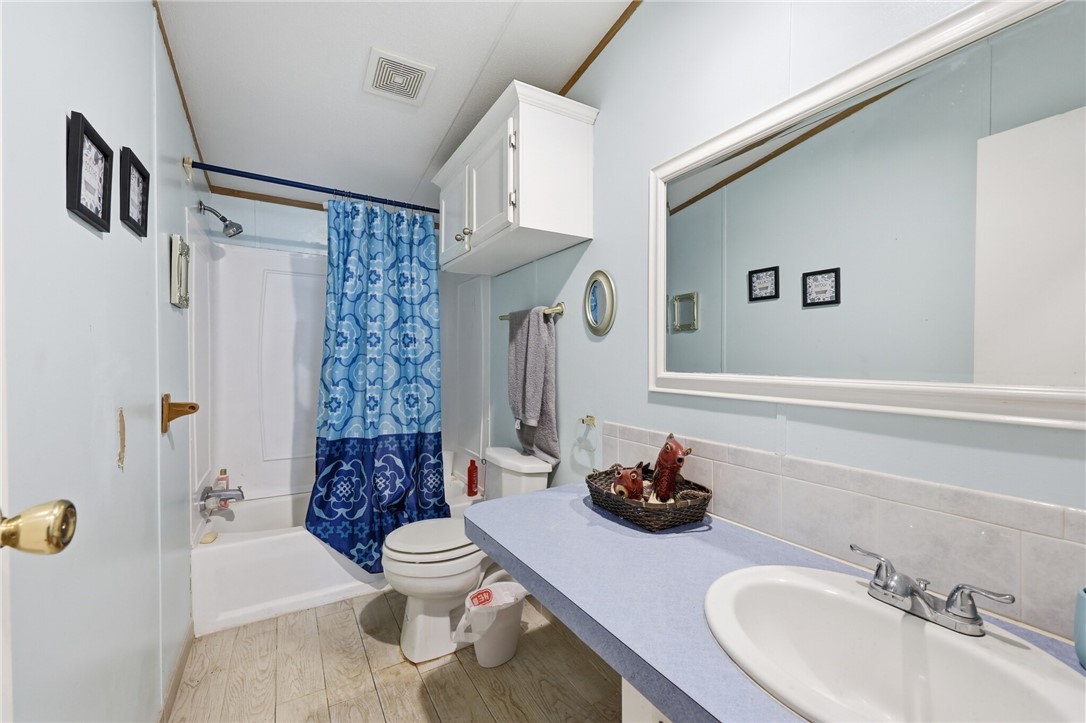 5730 Mockingbird Lane Mathis, TX 78368 - Photo 22 of 40 a bathroom with a sink toilet and shower