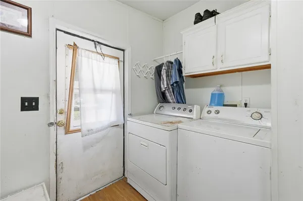 a view of a chairs and table in the backyard