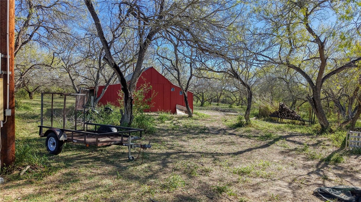 5730 Mockingbird Lane Mathis, TX 78368 - Photo 4 of 40 a backyard of a house with lots of green space