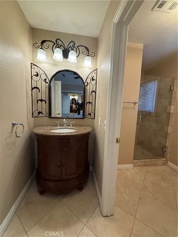 a view of entryway with a vanity and mirror