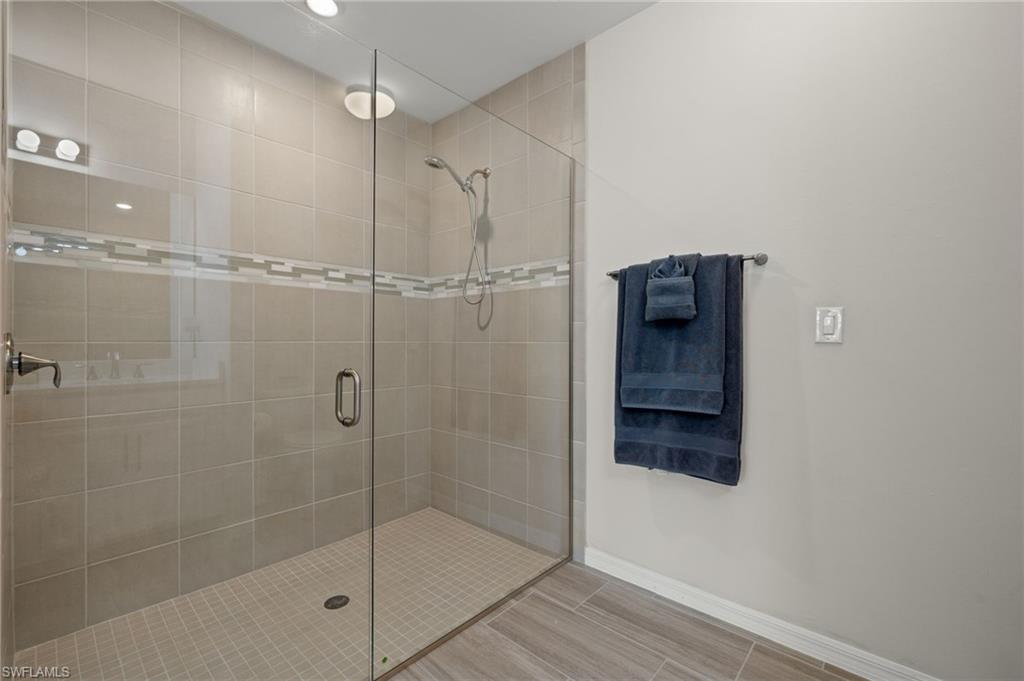 14680 Edgewater Circle Naples, FL 34114 - Photo 15 of 33 a bathroom with a shower