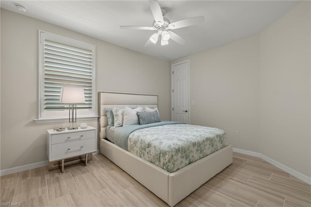 14680 Edgewater Circle Naples, FL 34114 - Photo 18 of 33 a bedroom with a bed and a window