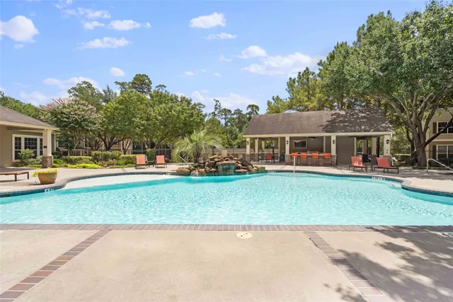 a view of a patio with swimming pool
