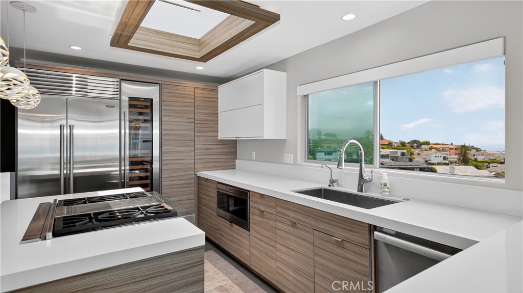 855 Santa Ana Street Laguna Beach, CA 92651 - Photo 14 of 35 a kitchen with a stove a sink and a refrigerator