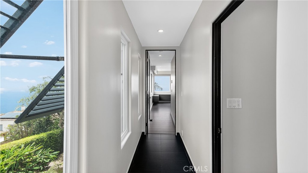 855 Santa Ana Street Laguna Beach, CA 92651 - Photo 15 of 35 a view of a hallway with wooden floor and staircase