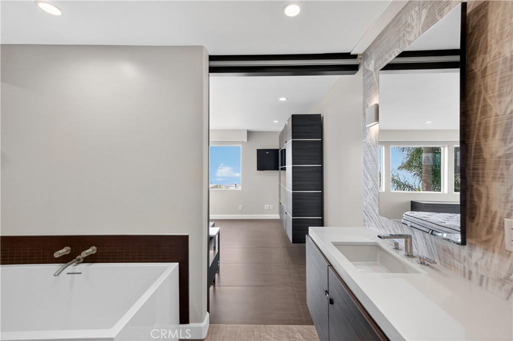 855 Santa Ana Street Laguna Beach, CA 92651 - Photo 18 of 35 a bathroom with a tub sink and mirror