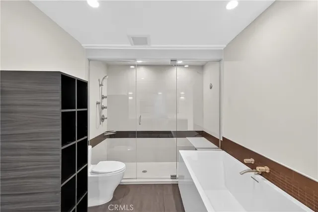 a bathroom with a toilet a sink and bathtub