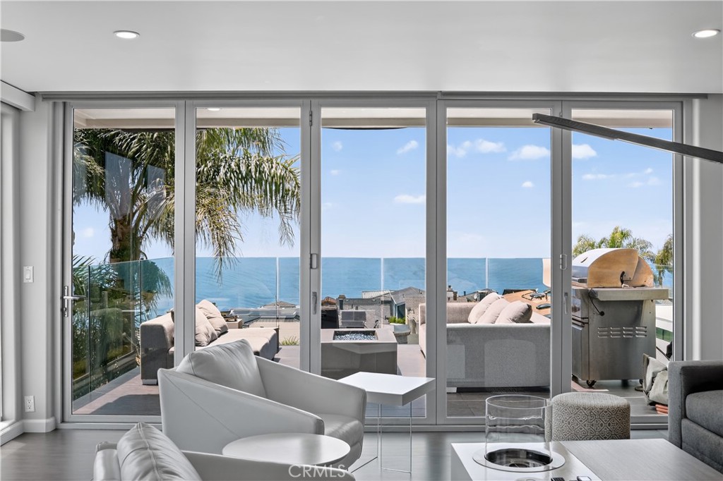 855 Santa Ana Street Laguna Beach, CA 92651 - Photo 22 of 35 a living room with furniture and a large window