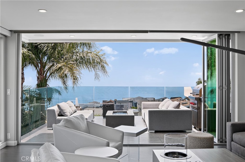 855 Santa Ana Street Laguna Beach, CA 92651 - Photo 23 of 35 a living room with furniture and a floor to ceiling window