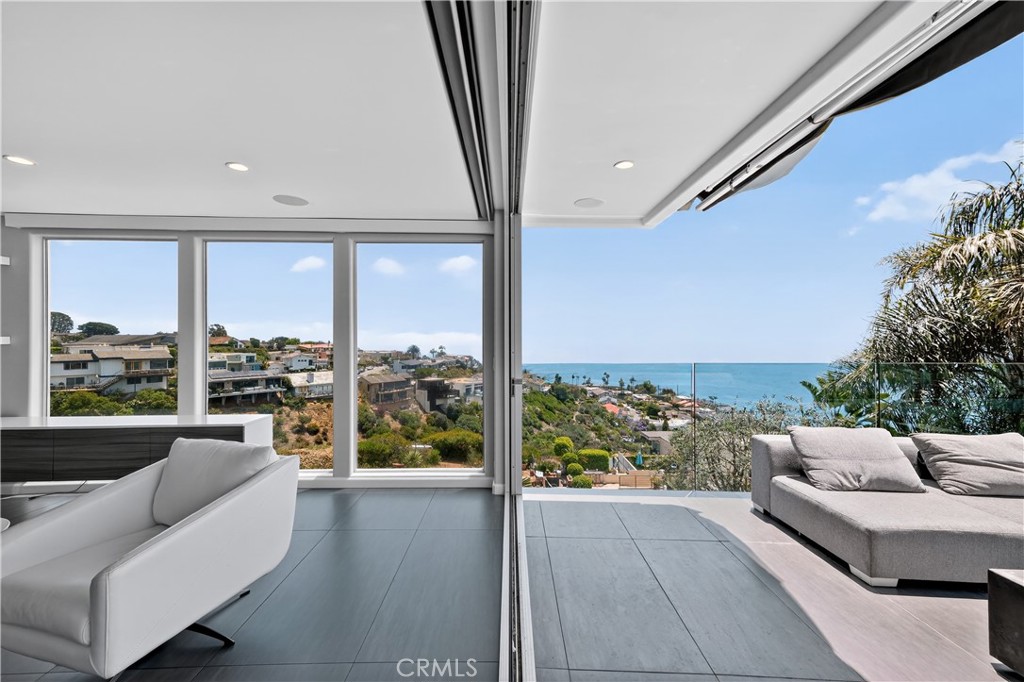 855 Santa Ana Street Laguna Beach, CA 92651 - Photo 27 of 35 a living room with furniture and a floor to ceiling window