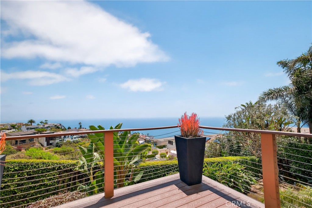 855 Santa Ana Street Laguna Beach, CA 92651 - Photo 31 of 35 a view of a balcony with wooden floor & fence
