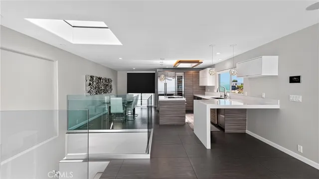 a kitchen with stainless steel appliances kitchen island granite countertop a sink and cabinets