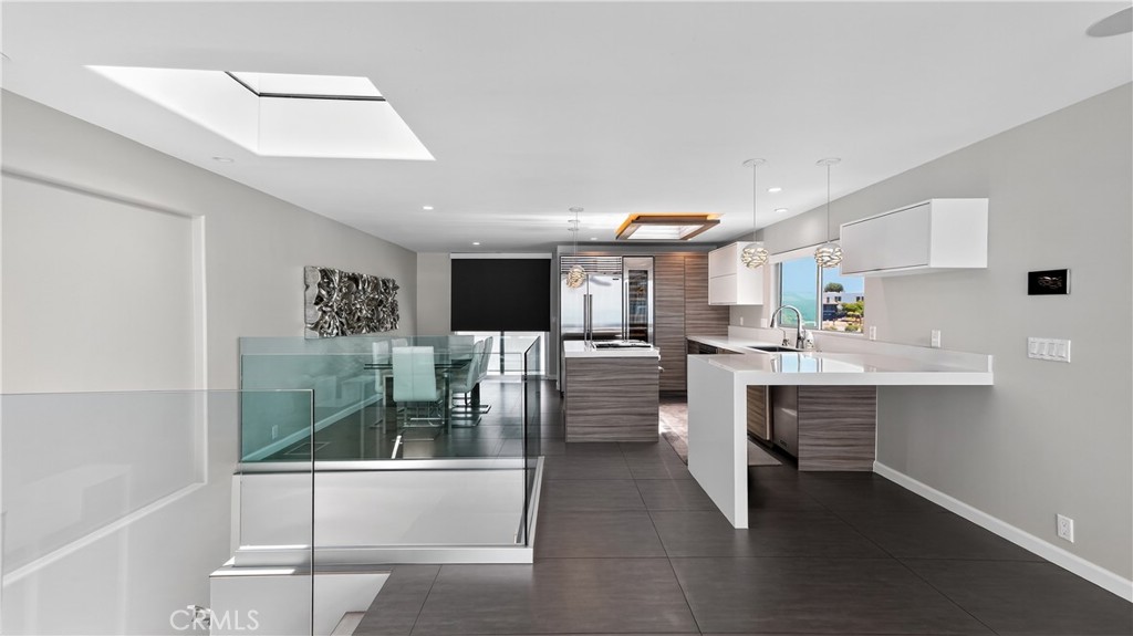 855 Santa Ana Street Laguna Beach, CA 92651 - Photo 7 of 35 a kitchen with stainless steel appliances kitchen island granite countertop a sink and cabinets