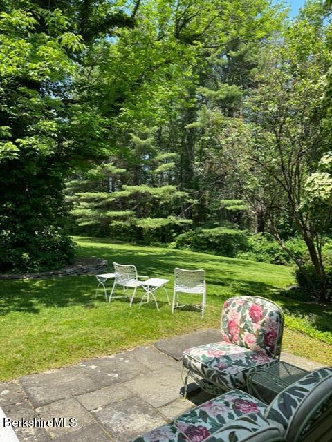 5 Glendale Road Stockbridge, MA 01262 - Photo 7 of 9 a view of a table and chairs in the garden