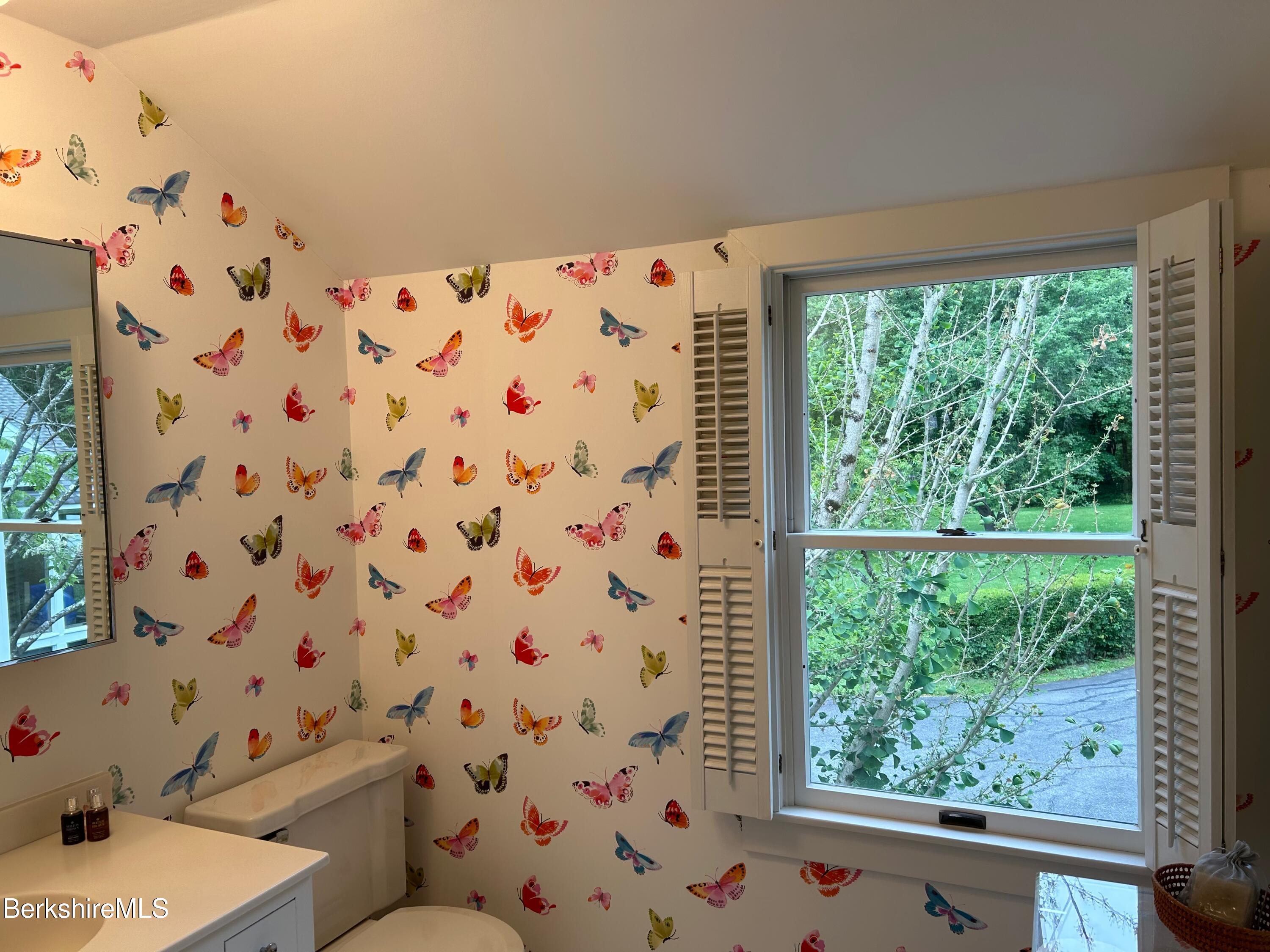 5 Glendale Road Stockbridge, MA 01262 - Photo 8 of 9 a bathroom with a toilet and a shower curtain