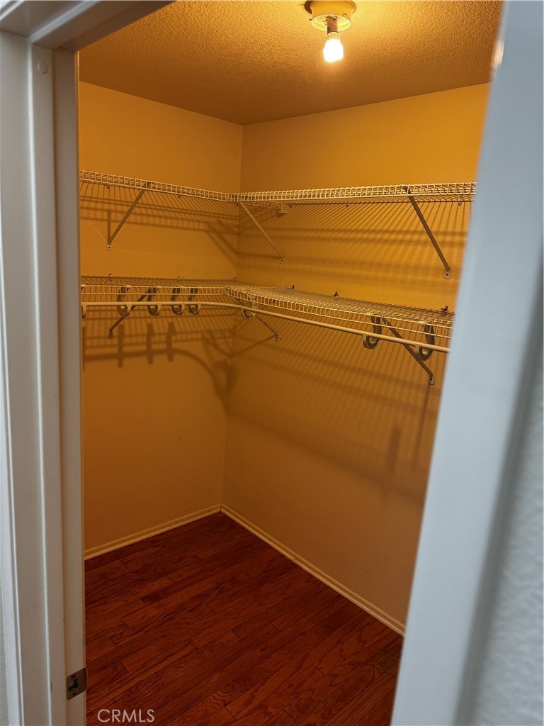 27519 Terrytown Road Menifee, CA 92586 - Photo 11 of 22 a view of walk in closet with empty space