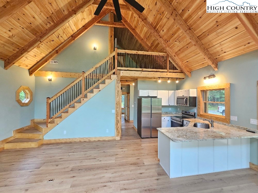 184 Presnell Road Sparta, NC 28675 - Photo 11 of 30 a view of a room with wooden floor and staircase