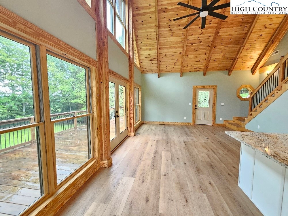 184 Presnell Road Sparta, NC 28675 - Photo 10 of 30 a view of hallway with a large window and wooden floor
