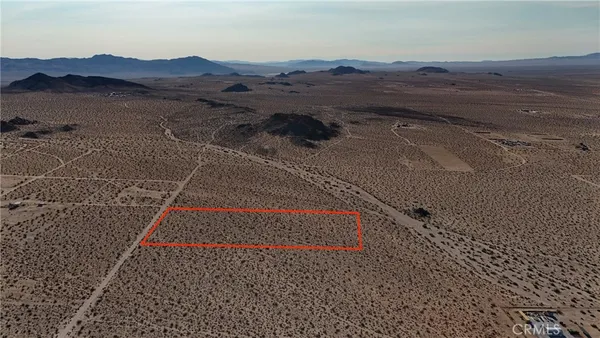 a view of mountains and valleys