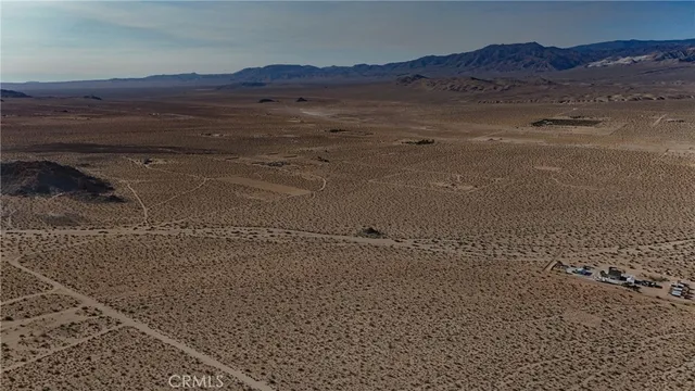 a view of an ocean beach and mountain