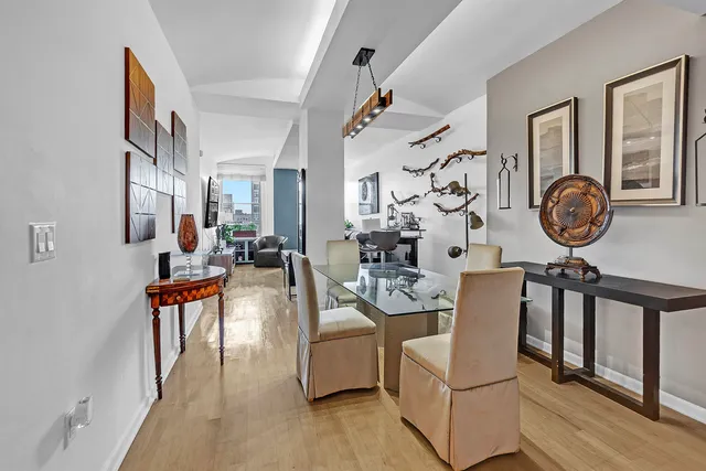 a living room with fireplace furniture and a wooden floor