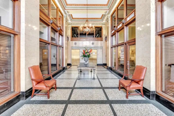 a view of a patio with a dining table and chairs