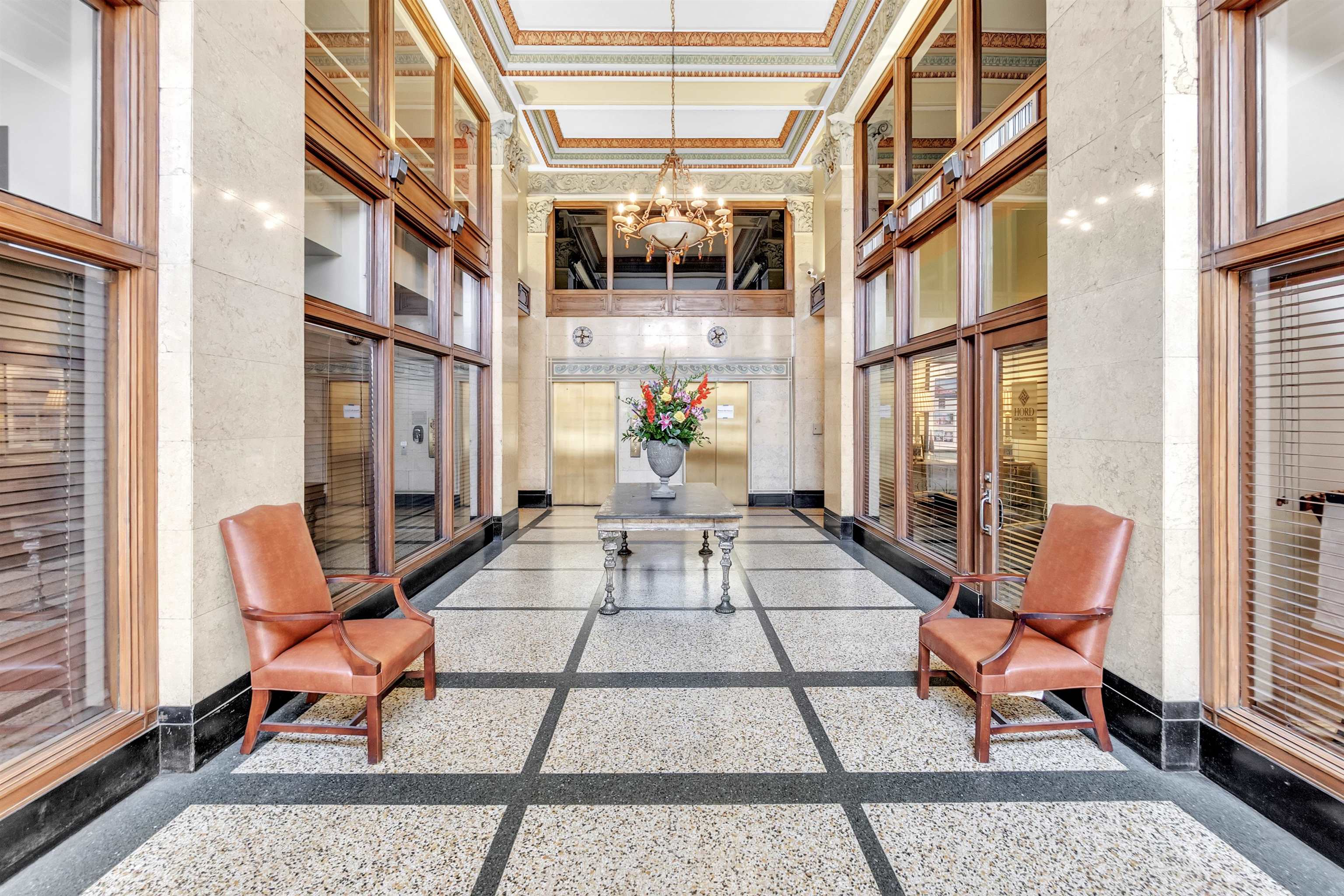 66 Monroe Avenue, Unit 606 Memphis, TN 38103 - Photo 4 of 9 a view of a patio with a dining table and chairs