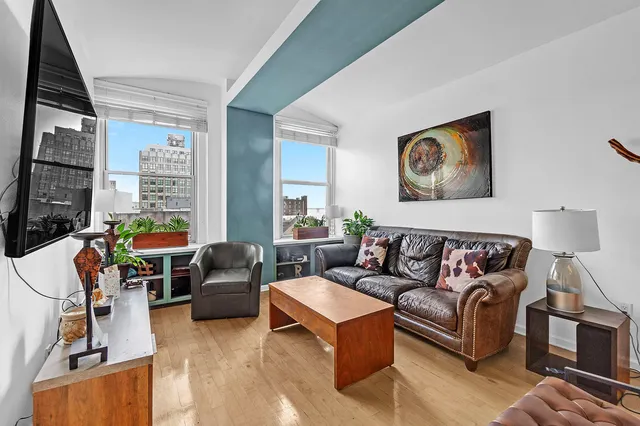 a living room with furniture or couch and a large window