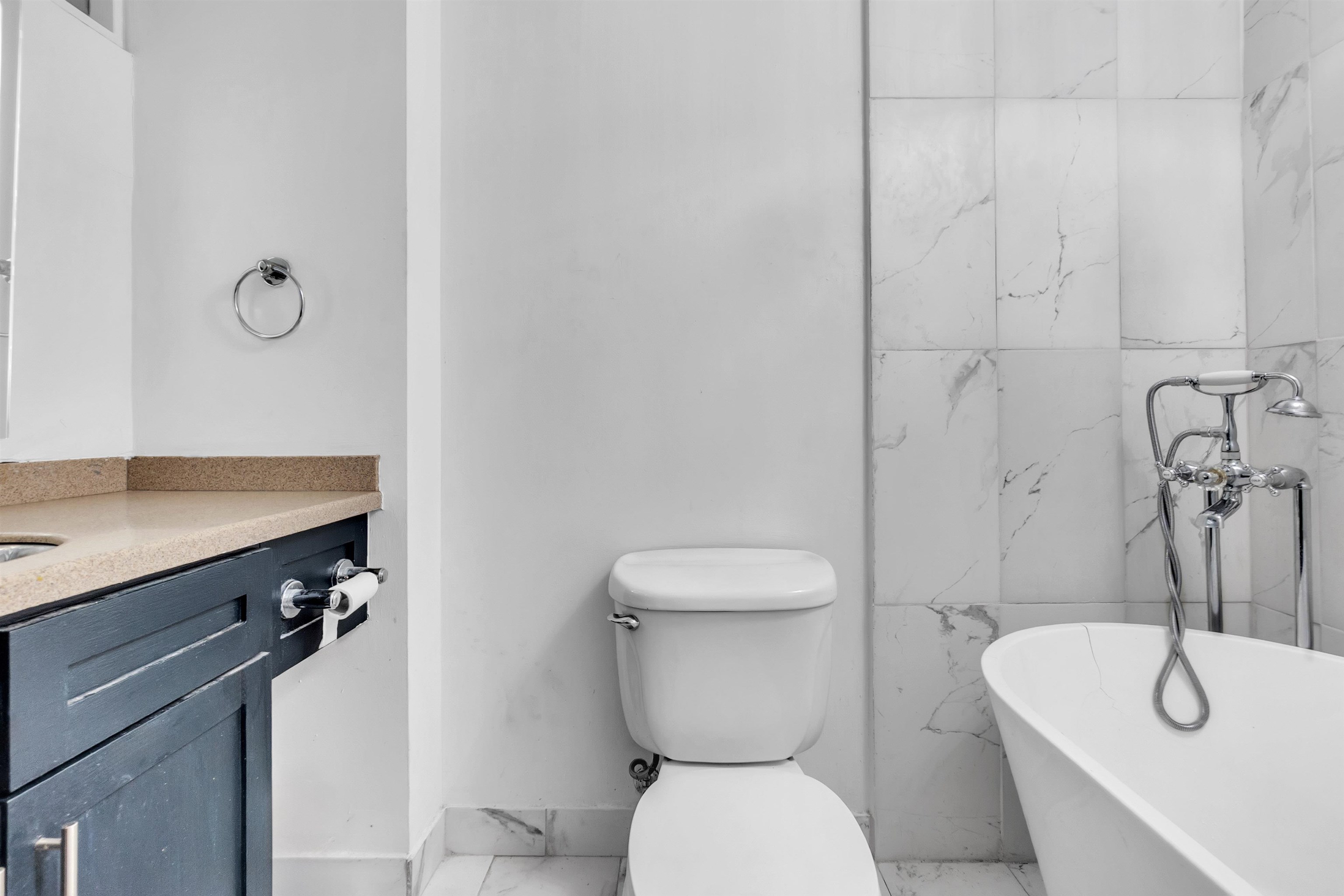 66 Monroe Avenue, Unit 606 Memphis, TN 38103 - Photo 8 of 9 a bathroom with a toilet sink and mirror