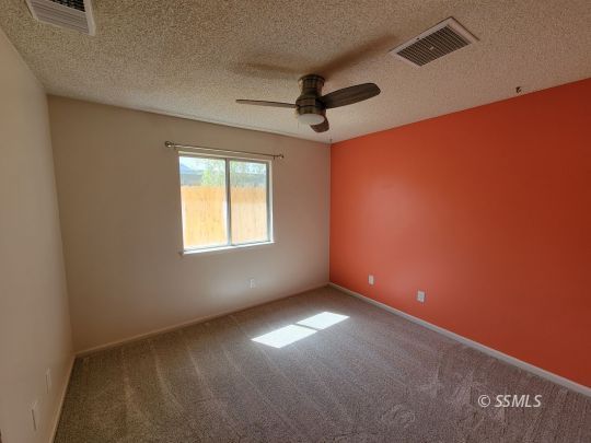 724 Ginger Avenue Ridgecrest, CA 93555 - Photo 13 of 21 a view of an empty room with a window