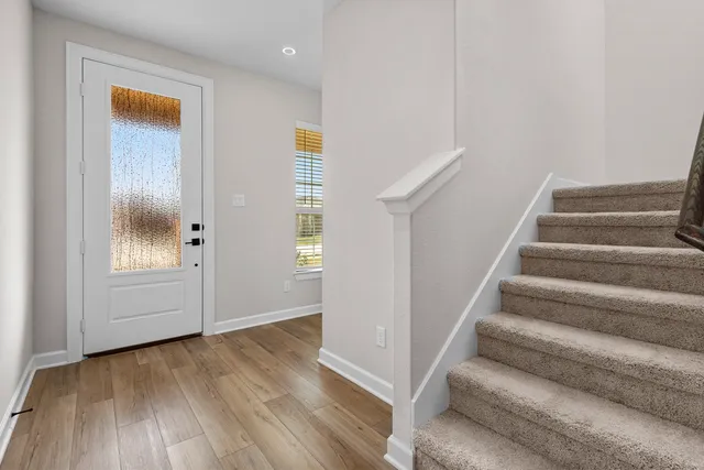 a view of entryway with wooden floor