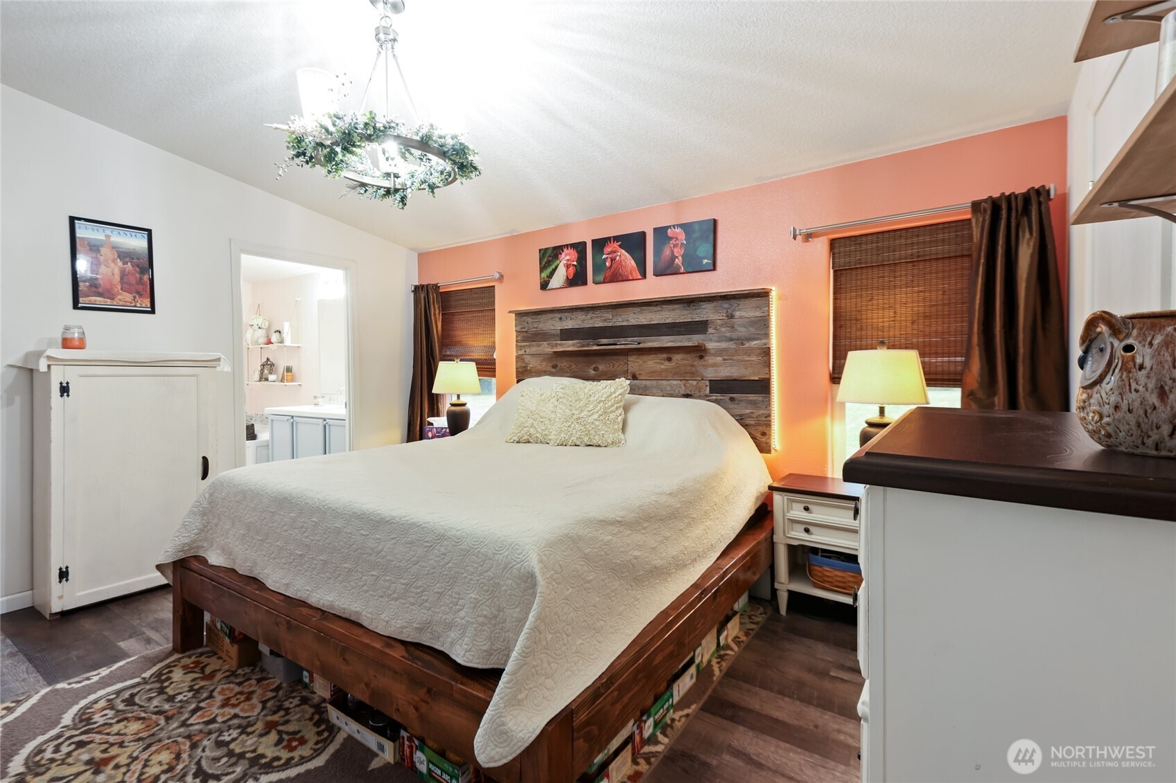 6509 176th Avenue Southwest Longbranch, WA 98351 - Photo 11 of 32 a bedroom with a bed and a chandelier