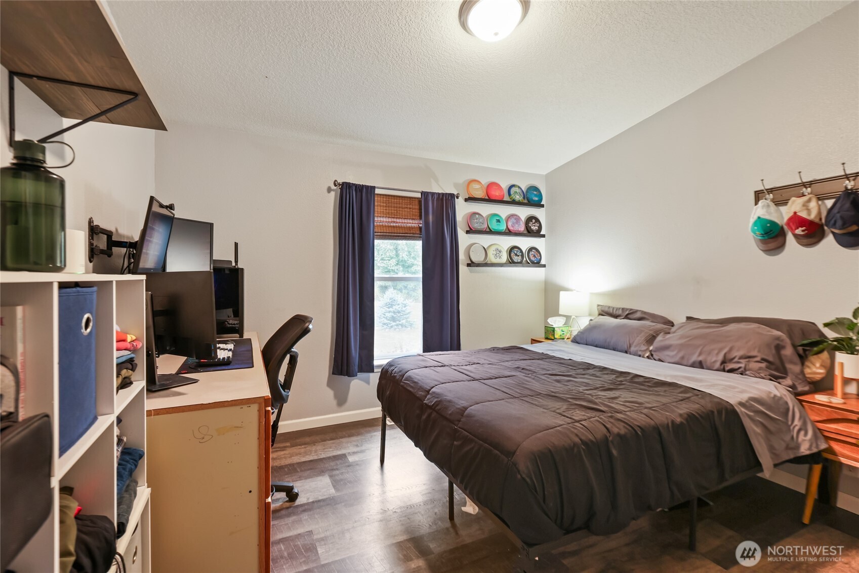 6509 176th Avenue Southwest Longbranch, WA 98351 - Photo 19 of 32 a bedroom with a bed and a desk